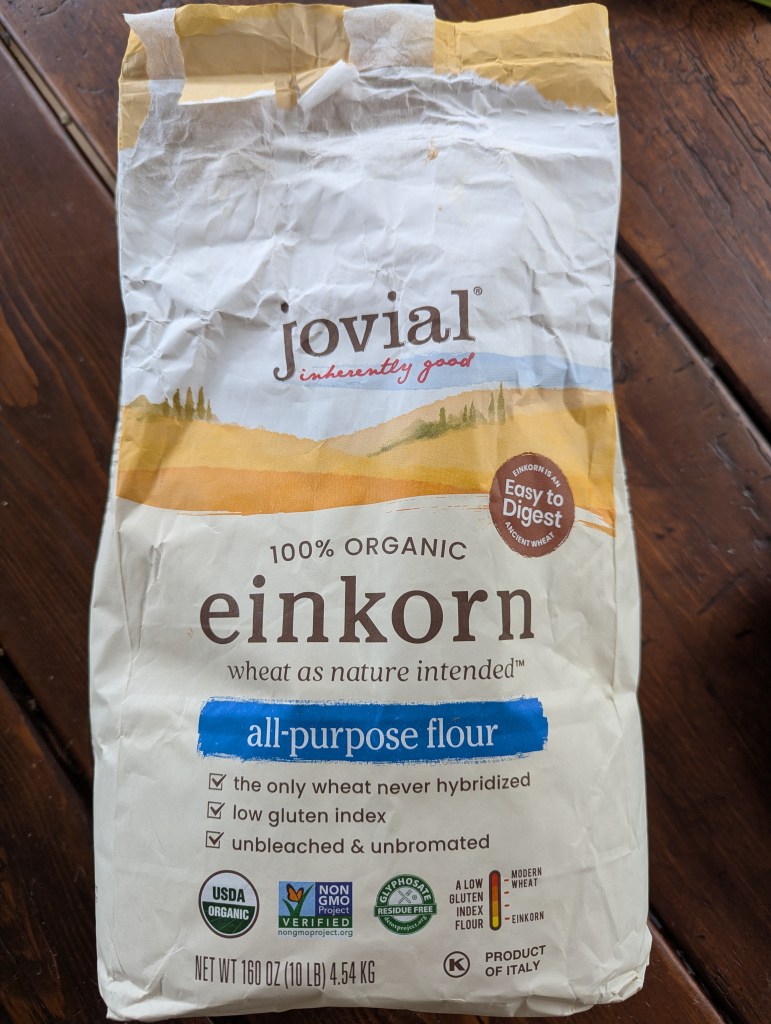 Aerial shot of einkorn flour bag on a wooden table
