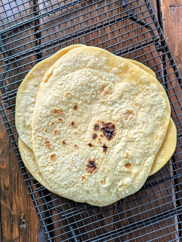 Soft einkorn tortilla recipe on a wire rack