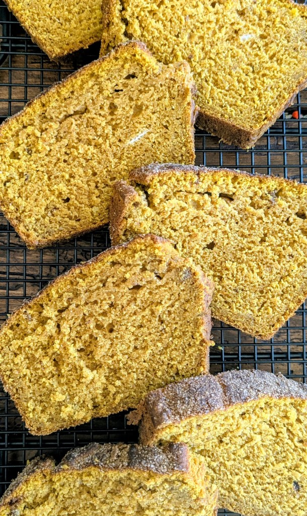 Slices of sourdough pumpkin bread on a wire rack