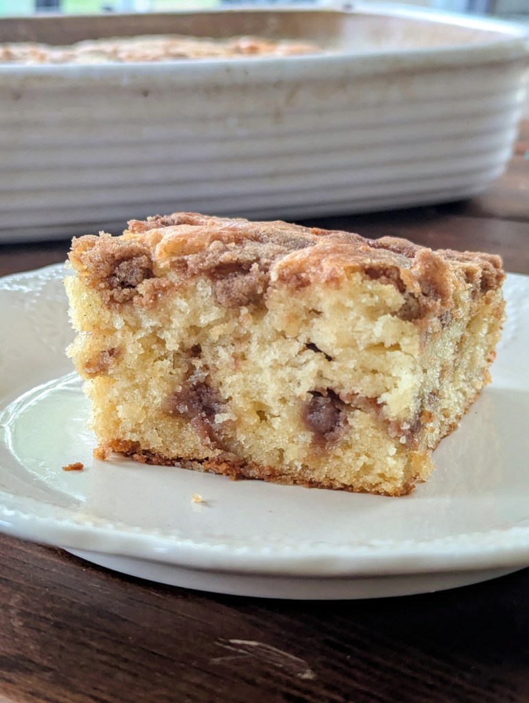 slice of sourdough discard coffee cake with cinnamon filling