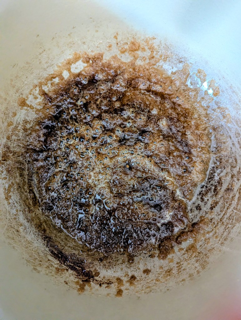 Melting butter, sugar, and spices in a Dutch oven to cook apples