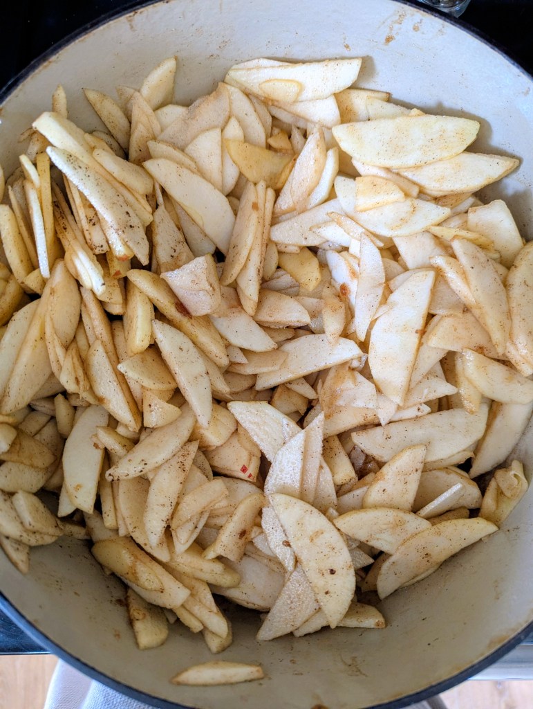 Cooking apples in a dutch oven before adding to pie crust